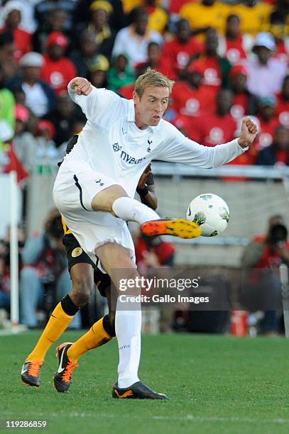 Peter Crouch of Tottenham and Dominic Mateba of Chiefs during the 2011 Vodacom Challenge match between Kaizer Chiefs and Tottenham Hotspur at Peter...