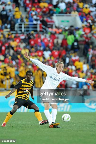 Peter Crouch of Tottenham and Thomas Sweswe of Chiefs during the 2011 Vodacom Challenge match between Kaizer Chiefs and Tottenham Hotspur at Peter...