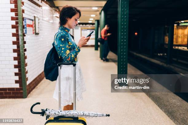 tourist woman waiting for the subway train - budapest metro stock pictures, royalty-free photos & images