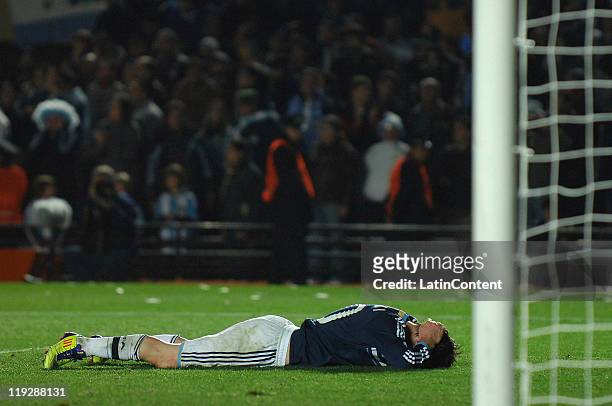 Lionel Messi, laments on the grass after being eliminated of the Copa America at Brigadier Lopez Stadium on July 16, 2011 in santa Fe, Argentina