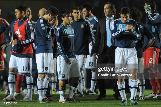 Argentinean players lament after being eliminated by Uruguay a match as part of Finals Quarters of 2011 Copa America at Brigadier Lopez Stadium on...