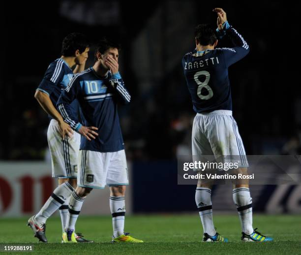 July 16: Argentina's players react after missing the penalty serie against Uruguay during 2011 Copa America soccer match as part of quartes final at...