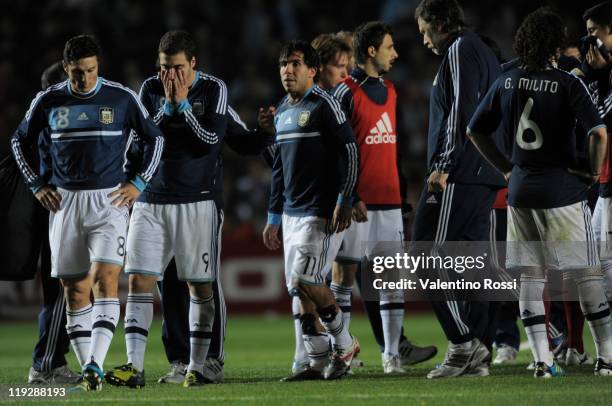 Argentina's players react after missing the penalty serie against Uruguay during 2011 Copa America soccer match as part of quartes final at Brigadier...