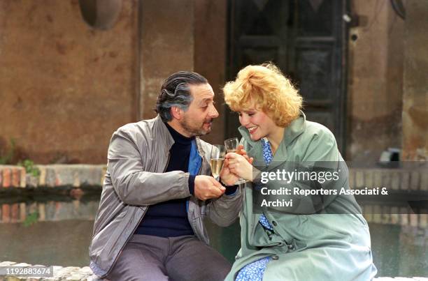 Italian actors Leo Gullotta and Antonella Ponziani toasting in the film Blue Tango. 1987