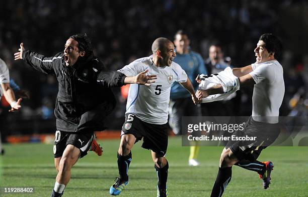 The team of Uruguay celebrate after the game between Argentina and Uruguay as part of the Cuarter Final, of Copa America 2011 at Brigadier Lopez...