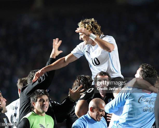 Diego Forlan and the teammates of Uruguay celebrate after the victory between Argentina and Uruguay as part of the Cuarter Final, of Copa America...