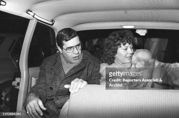 American comic actor Jerry Lewis and his wife, the dancer Sandee Pitnick sitting in a car. Rome, 17th January 1984