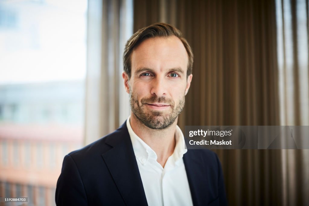 Portrait of male legal advisor in formals at office