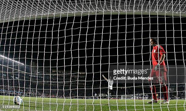 Goalkeeper Sergio Romero stares at the ball after failing to stop a penalty during a match between Argentina and Uruguay as part od the Quarter Fina...