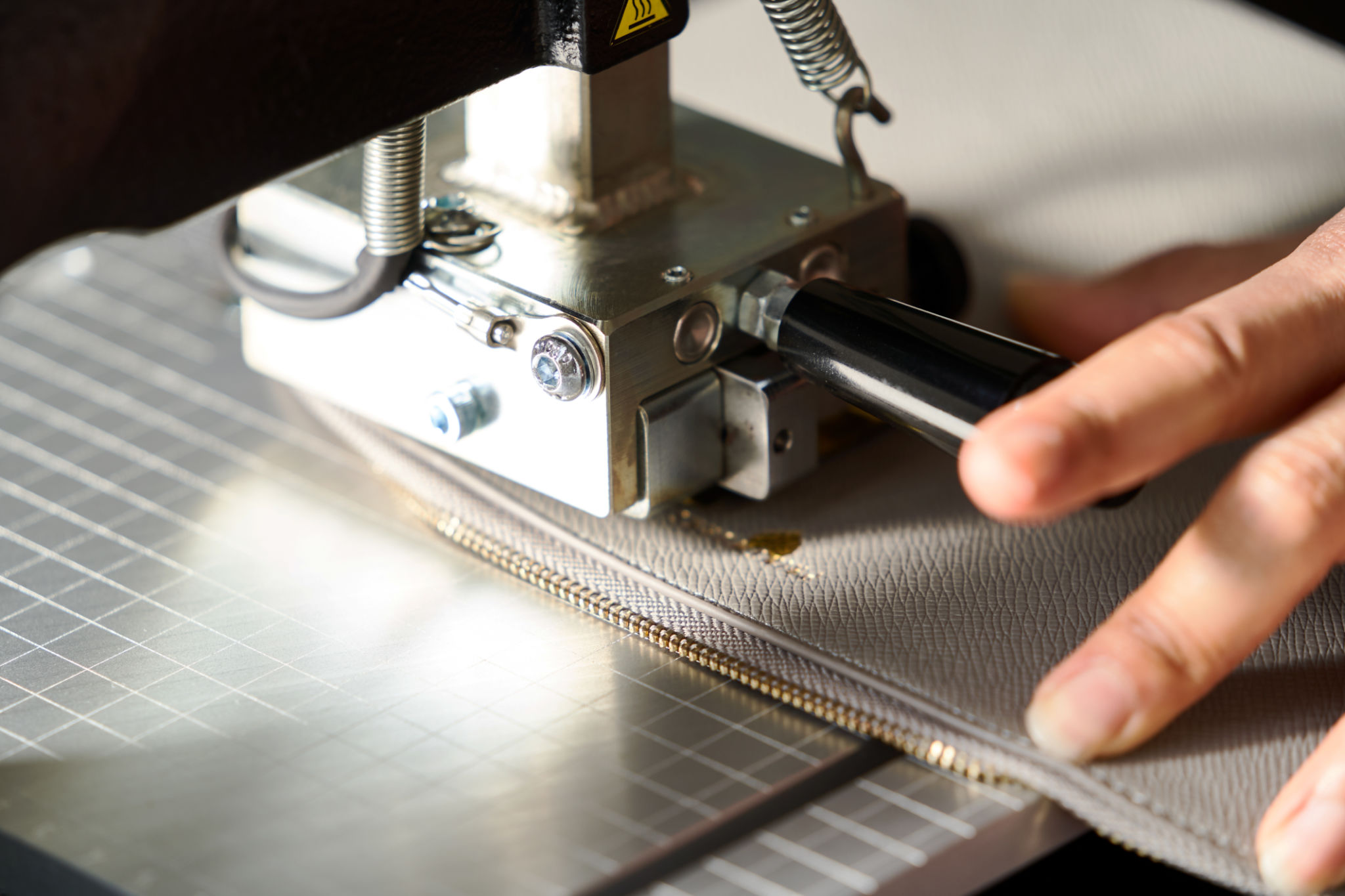 Leather crafting concept with leather engraving machine, close-up Leather crafting concept with leather engraving machine, close-up