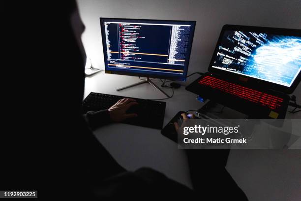 computer hacker stealing data from a laptop - data breach stock pictures, royalty-free photos & images
