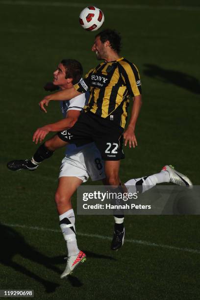 Andrew Durante of the Phoenix competes with Ethan Galbraith of the Junior All Whites during the pre-season friendly match between the Wellington...