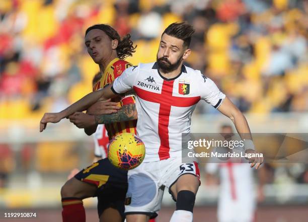 Jacopo Petriccione of Lecce competes for the ball with Marko Pajac of Genoa during the Serie A match between US Lecce and Genoa CFC at Stadio Via del...