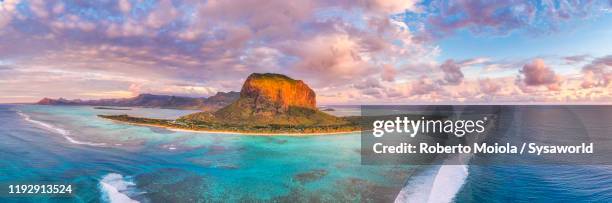 sunset over le morne brabant peninsula and coral reef, aerial view, mauritius - isole mauritius stock pictures, royalty-free photos & images