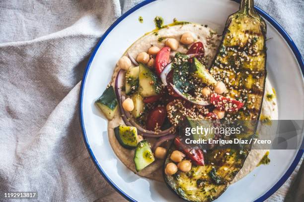 grilled eggplant, hummus and salad healthy dinner - 7cero stock pictures, royalty-free photos & images