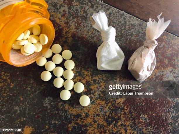 prescription medications, cocaine, and heroin bags - drug trafficking stock pictures, royalty-free photos & images