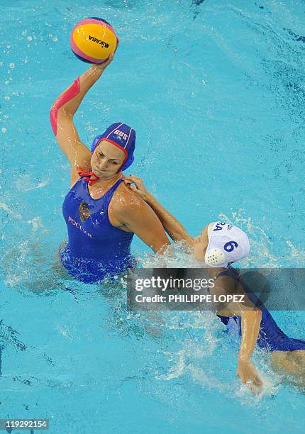 Russia's Sofia Konukh and Brazil's Gabriela Leme Gozani compete in their group C women's water polo preliminary round match in the FINA World...
