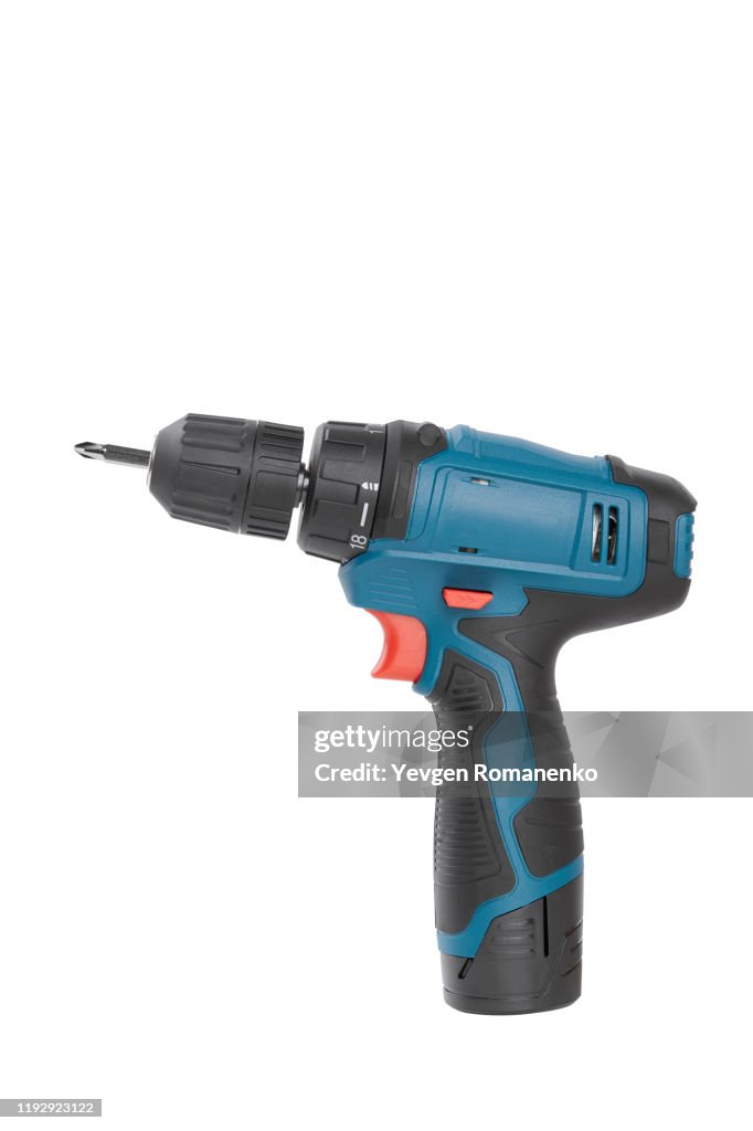 Battery screwdriver or drill, isolated on white background