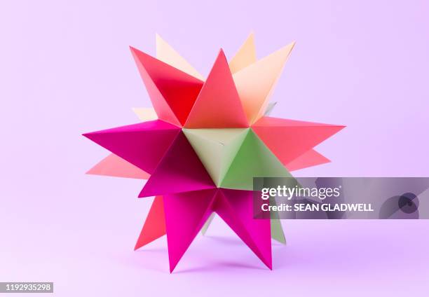 vibrant origami star - spiked stock photos et images de collection