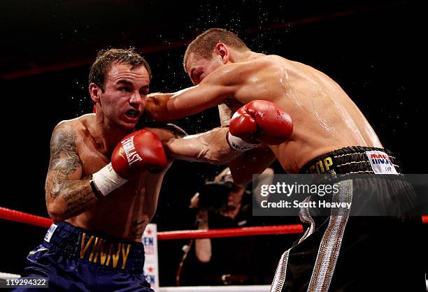 John Murray connects with Kevin Mitchell during the vacant WBO Inter-Continental Lightweight Championship bout at Echo Arena on July 16, 2011 in...