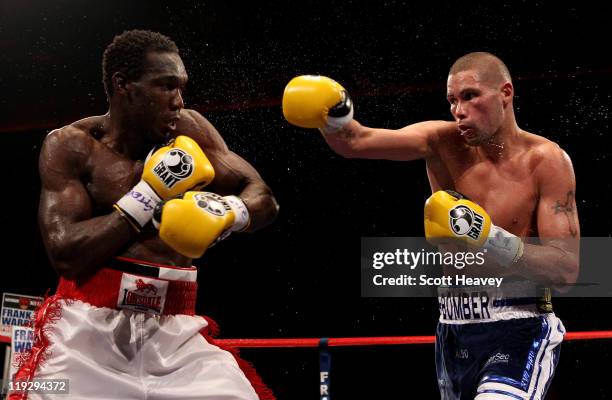 Tony Bellew connects with Ovill McKenzie during the Commonwealth And Vacant British Light-Heavyweight Championship bout at Echo Arena on July 16,...