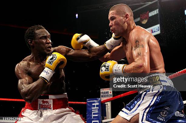 Tony Bellew connects with Ovill McKenzie during the Commonwealth And Vacant British Light-Heavyweight Championship bout at Echo Arena on July 16,...