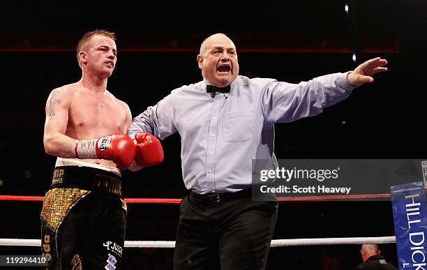 Frankie Gavin with referee Richie Davies during the WBO Intercontinental Welterweight Championship bout bout against Curtis Woodhouse at Echo Arena...