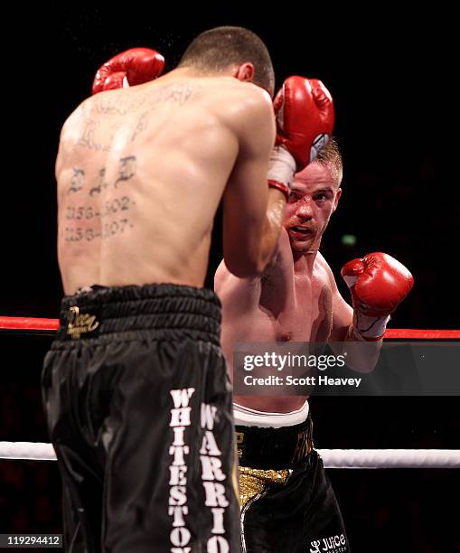 Frankie Gavin connects with Curtis Woodhouse during the WBO Intercontinental Welterweight Championship bout bout at Echo Arena on July 16, 2011 in...