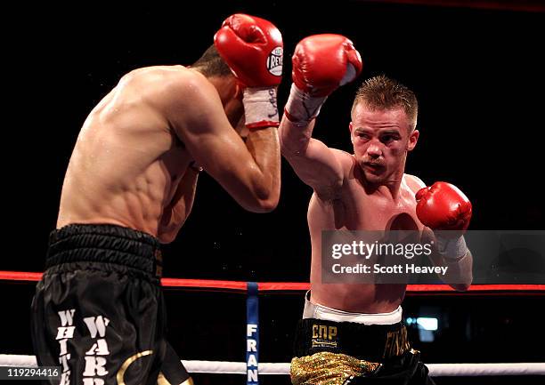 Frankie Gavin attempts a right jab on Curtis Woodhouse during the WBO Intercontinental Welterweight Championship bout bout at Echo Arena on July 16,...