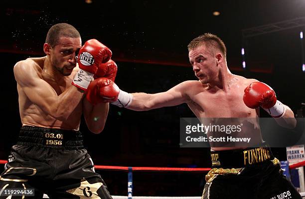 Frankie Gavin connects with Curtis Woodhouse during the WBO Intercontinental Welterweight Championship bout bout at Echo Arena on July 16, 2011 in...