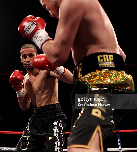 Curtis Woodhouse battles with Frankie Gavin during the WBO Intercontinental Welterweight Championship bout bout at Echo Arena on July 16, 2011 in...