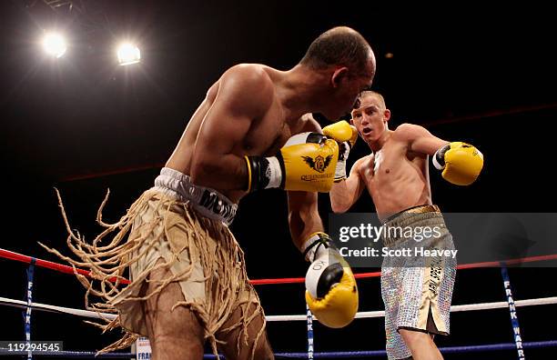 Paul Butler battles with Anwar Alfadli the Super-Flyweight bout against at Echo Arena on July 16, 2011 in Liverpool, England.