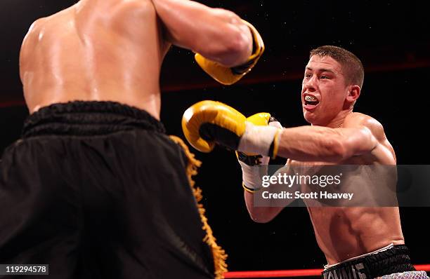 Ronnie Heffron in action during the Welterweight bout with Barrie Jones at Echo Arena on July 16, 2011 in Liverpool, England.