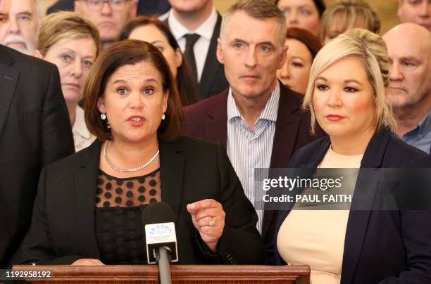 Irish republican Sinn Fein party leader Mary Lou McDonald speaks flanked by deputy leader Michelle O'Neill and other colleagues during a media...