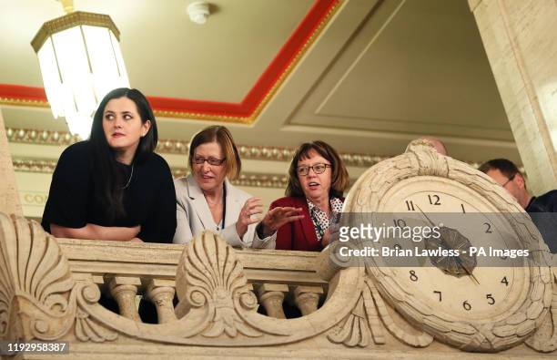 People gather on the balcony of in the Great Hall of Parliament Buildings, Stormont, as they await the arrival of Sinn Fein for a press conference as...