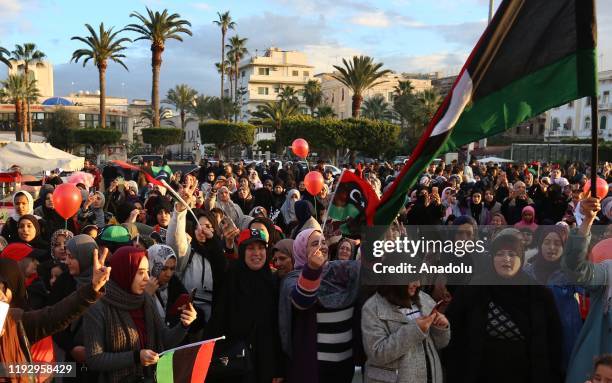 Women take part in a demonstration against eastern military commander Khalifa Haftar, who is based in the east of the country, and in support of the...