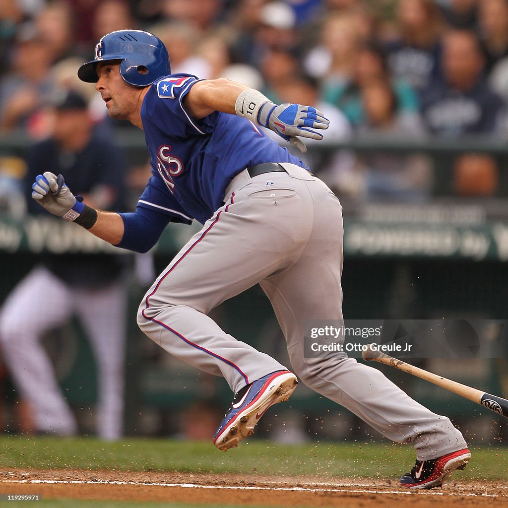 Seattle Rangers Michael Young of the Texas Rangers hits an RBI single in the third ...