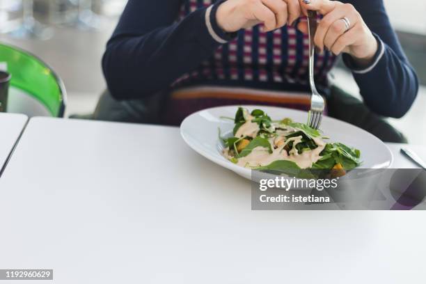 pregnant woman eating fresh vegan salad at cafe - soy dressing stock pictures, royalty-free photos & images