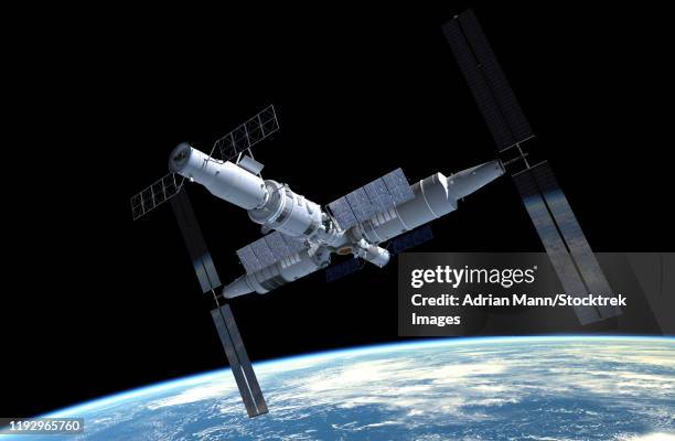 artist's concept of the chinese space station tiangon-3 in orbit. - space station stock illustrations
