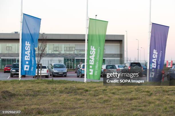 Flags with BASF logo seen in front of the biggest BASF catalyst production plant in Sroda Slaska.