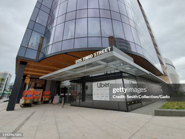 Wide angle of sign at new headquarters of ridesharing company Uber in Mission Bay, San Francisco, California, December 5, 2019.