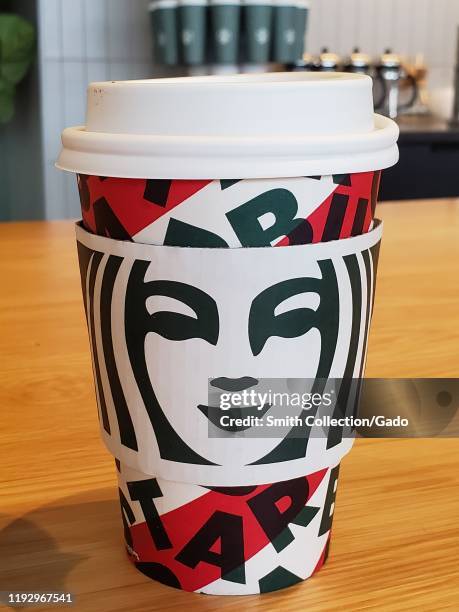Close-up of 2019 holiday cup design at Starbucks Coffee cafe in San Ramon, California, November 30, 2019. Starbucks' cups have provoked controversy...