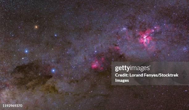 widefield view of the crux constellation and nebulae in the southern milky way - southern cross stars stock pictures, royalty-free photos & images