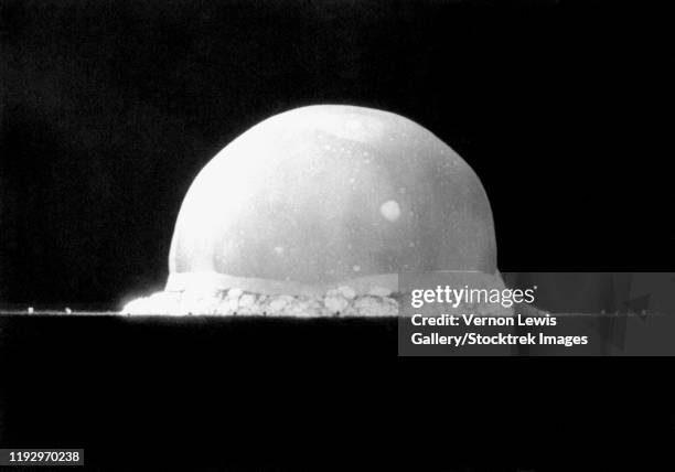 an explosive fireball of the first nuclear bomb test, code name trinity, july 16, 1945. - atomic bomb stock pictures, royalty-free photos & images