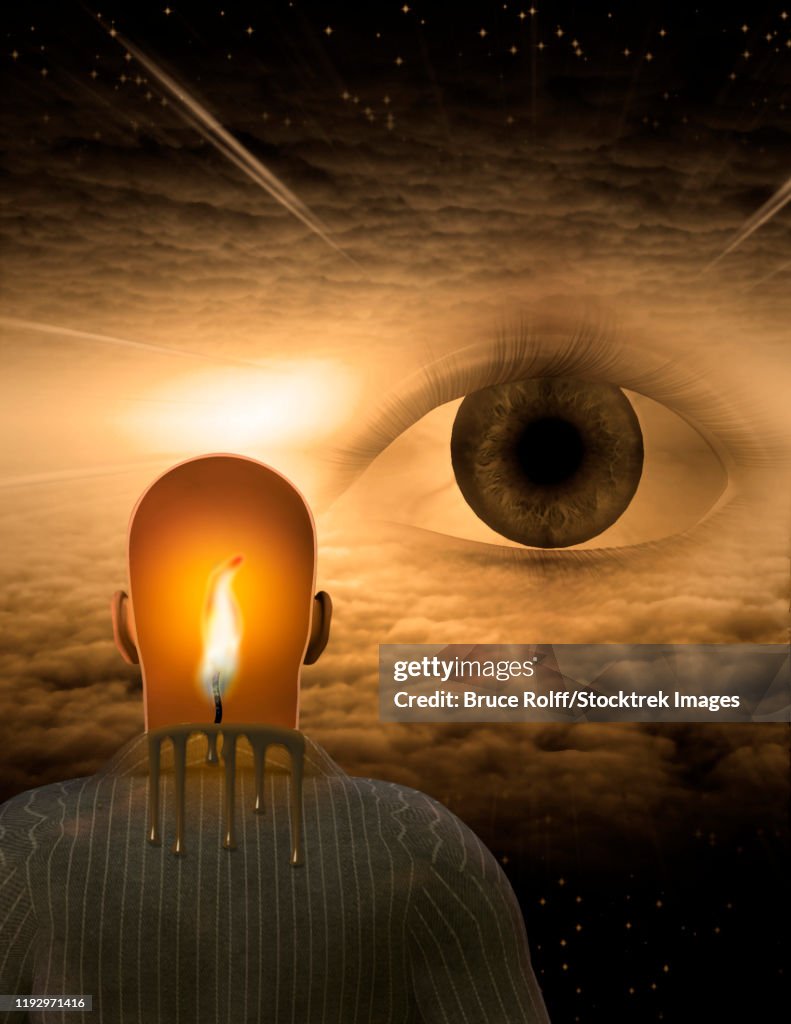 Man with burning mind in surreal cloud filled space with giant eye.