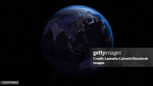 planet earth showing oceania in night time with city lights. - satellitenaufnahme nacht stadt stock-grafiken, -clipart, -cartoons und -symbole