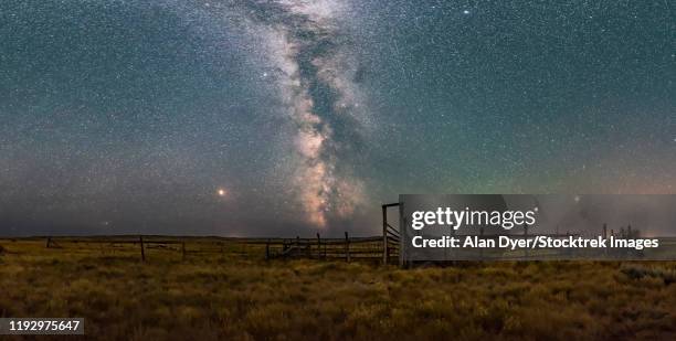 a partial panorama of the summer sky and milky way in the frenchman valley, canada. - arcas stock pictures, royalty-free photos & images