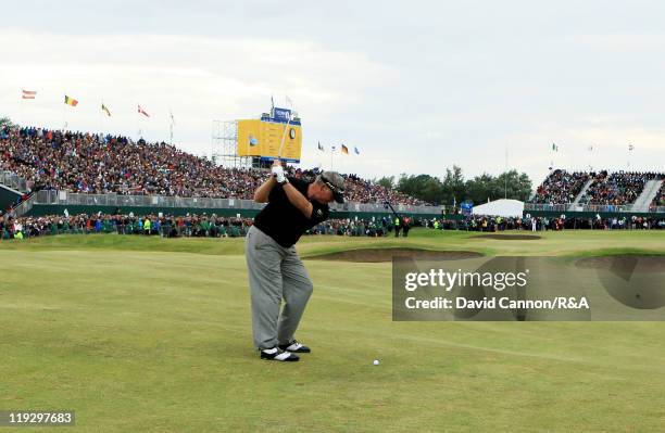 Darren Clarke of Northern Ireland makes his approach shot to the 18th green during the final round of The 140th Open Championship at Royal St...