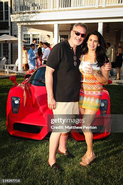 Tax Doctor Richard Stein and wife Susan Stein pose together with their 2003 Ferrari Enzo Supercar at Nathaniel Christian's Annual Hamptons Ferrari...