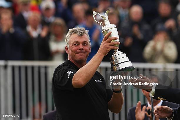 Darren Clarke of Northern Ireland lifts the Claret Jug following his victory at the end of the final round of The 140th Open Championship at Royal St...